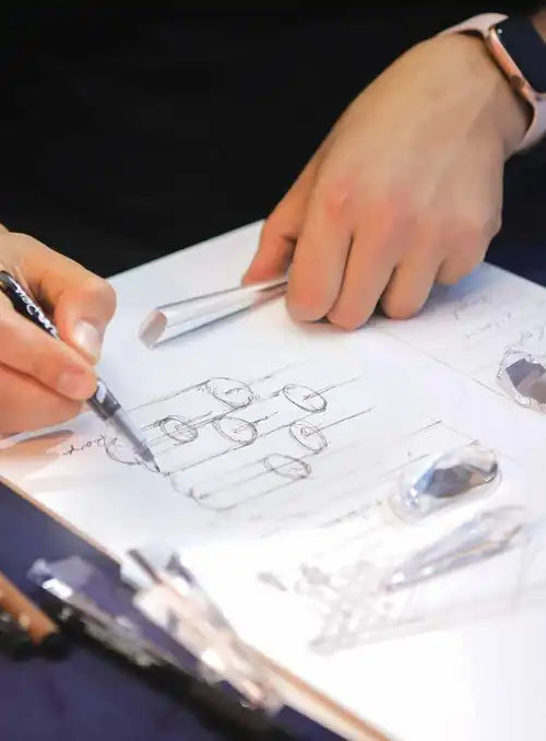 Hand sketching a Glitz chandelier design in Brooklyn