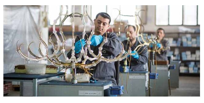 Asfour artisans assembling a chandelier in Egypt